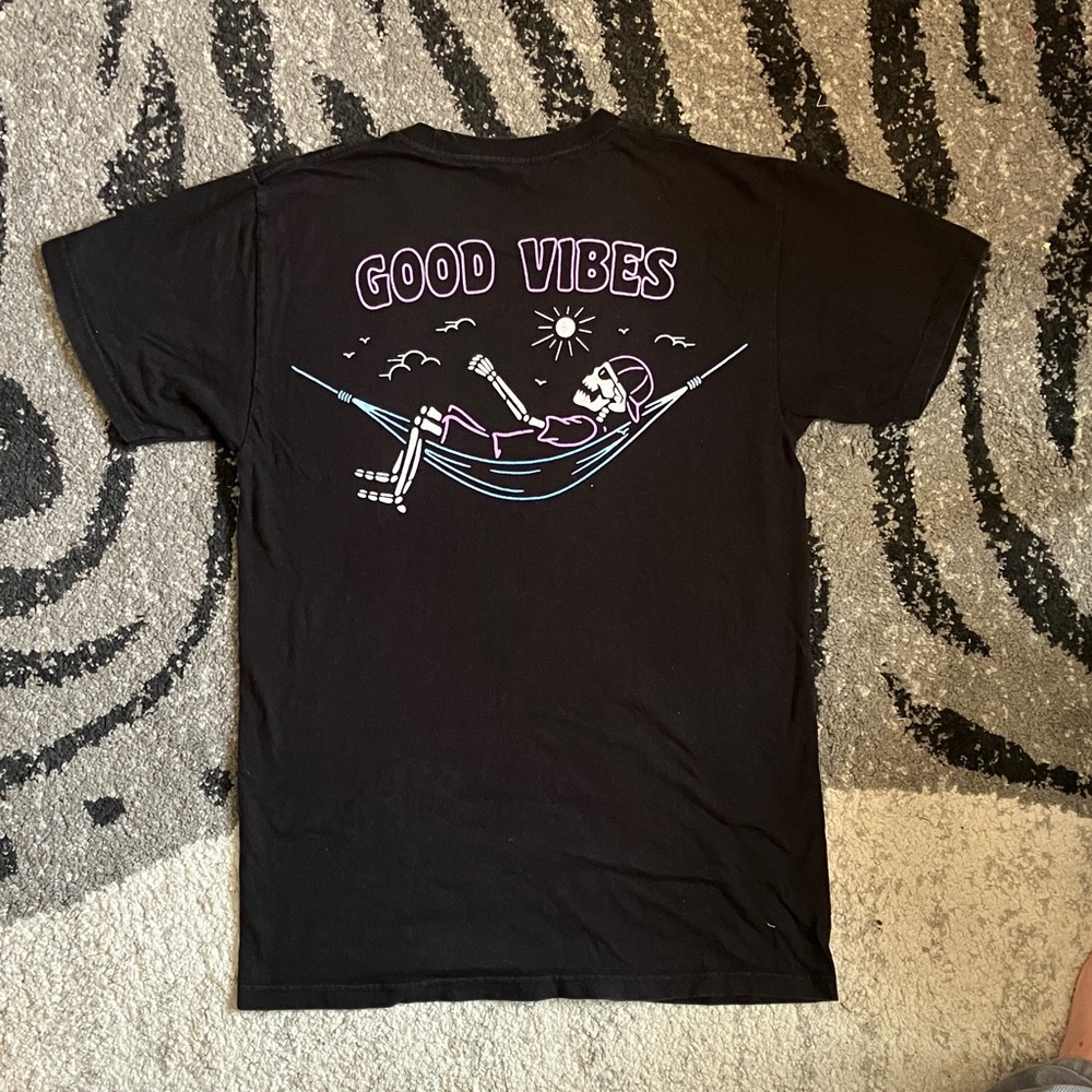 Black Graphic Tee with Relaxing Skeleton